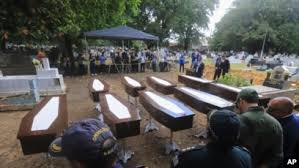 Nine African migrants buried in secular ceremony in Brazil.